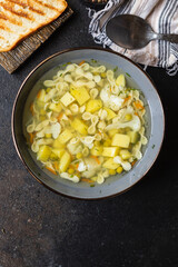 vegetable soup pasta first course broth, potatoe, cauliflower, carrot no meat vegetarian or vegan portion on the table meal snack top view copy space for text food background