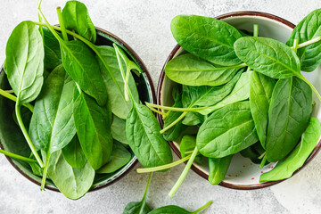 spinach healthy food fresh green leaves cooking on the table cooking meal snack top view copy space food background rustic image keto or paleo diet vegan or vegetar