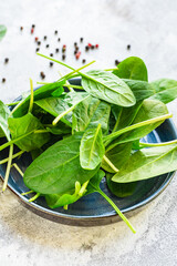 spinach healthy food fresh green leaves cooking on the table cooking meal snack top view copy space food background rustic image keto or paleo diet vegan or vegetar