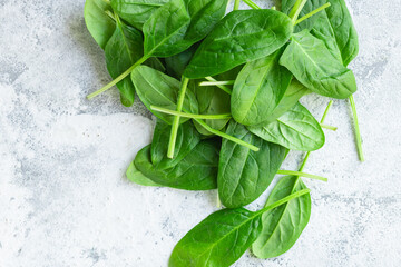spinach healthy food fresh green leaves cooking on the table cooking meal snack top view copy space food background rustic image keto or paleo diet vegan or vegetar