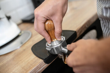 Male hands holding the filter holder handle