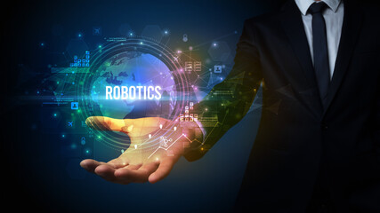 Elegant hand holding ROBOTICS inscription, digital technology concept