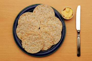 A plate of rice cakes with butter