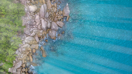 Obraz na płótnie Canvas Overhead aerial view of Seychelles Beach with rocks, ocean landscape