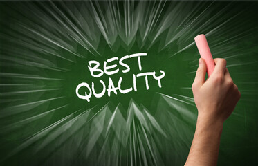 Hand drawing BEST QUALITY inscription with white chalk on blackboard, online shopping concept