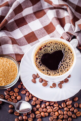 cup of fragrant fresh coffee on a dark stone background