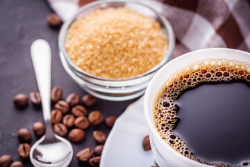 cup of fragrant fresh coffee on a dark stone background