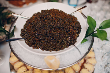 black sturgeon caviar on the table in a restaurant