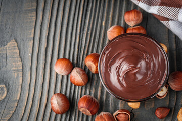 toasts with chocolate butter on a dark wooden rustic background