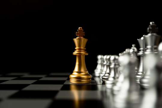 Golden King Chess Standing In Front Of Other Chess, Concept Of A Leader Must Have Courage And Challenge In The Competition, Leadership And Business Vision For A Win In Business Games