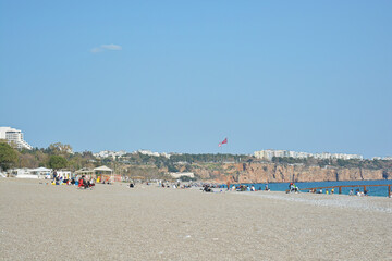 beach with cliffs and blue sea