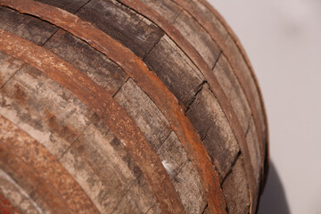 Old beer barrel. Background of a trunk and a worn old wooden table. 