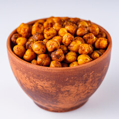 fried chickpeas on a white acrylic background