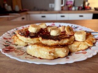 homemade cottage cheese pancakes with banana close-up