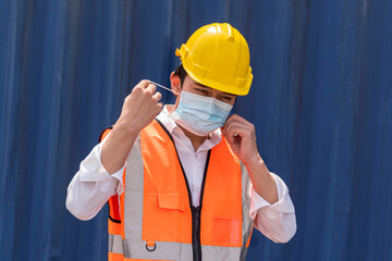 Factory worker wear safety dress cleaning hand with alcohol   sanitizer gel at outdoor warehouse - safety and health  protect coronavirus protocol concept