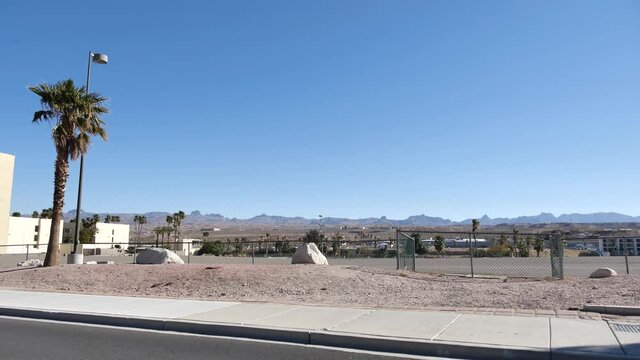 Driving on Road by Laughlin, Nevada USA, City in Desert Landscape on Sunny Day. Right Seat Passenger Point of View
