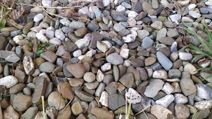 Road gravel, crushed stone. Gravel texture. Crack stones at a construction site. Seamless texture of white stones or gravel