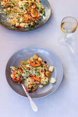 Couscous with vegetables and king prawns.
