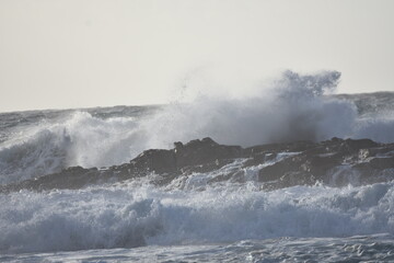 Watching the waves from the cliff