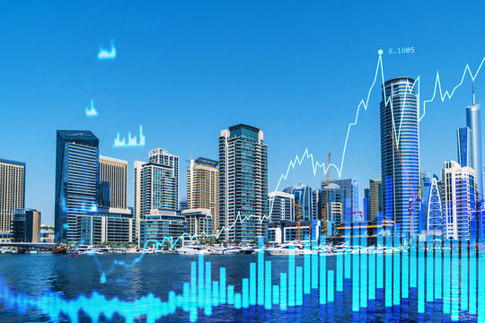 Skyscrapers of Dubai business downtown. International hub of trading and financial services of Western Asia. FOREX graph and chart concept. Double exposure. Dubai Canal waterfront.