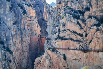 Very narrow path in rocky canyon - mountain wooden path along steep cliffs in Andalusia, Spain