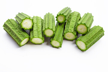 Fresh luffa vegetables on white background.