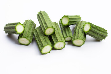 Fresh luffa vegetables on white background.