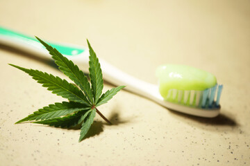 Cannabis infused toothpaste. Marijuana leaf. Oral care with CBD oil