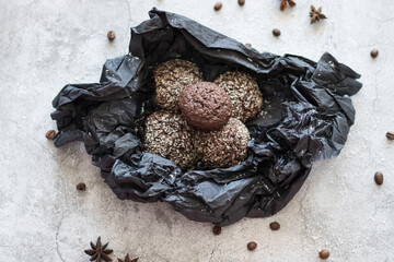 Chocolate chip cookies with coconut. Lie on a black and gray background.