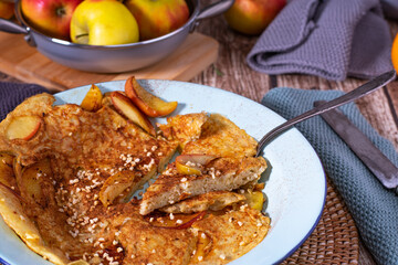 sweet rice pancake with glazed apples, roasted almonds and cinnamon