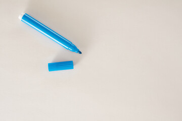 Blue felt tip pen on white background