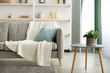 Fototapeta premium Cozy comfortable interior of house with candles and decorative elements