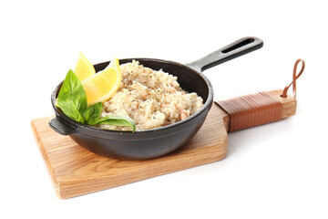 Frying pan with tasty risotto on white background