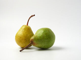 Green pear with a leaf isolated on white. Pear Clipping Path. Professional studio photo