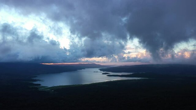 Sunset over the largest lake in Costa Rica aerial view from Arenal volcano