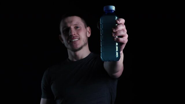 Man Showing Drink. Sportsman Holding Sport Drink. BCA, Sports Drink, Soft Drink, Sports concept