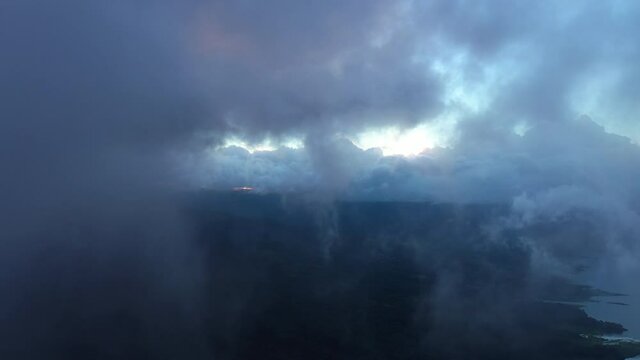 aerial mystic mountains discovering from the clouds sunset arenal volcano area Costa Rica