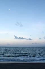 Beautiful landscape of the sea, moon, cloud and blue sky.