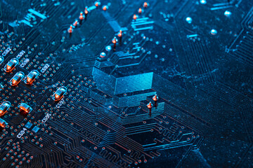 Electronic blue circuit board, computer microcircuit top view, selective focus. The concept of microprocessors, microchips, printed electronic circuits, technology, cybersecurity.