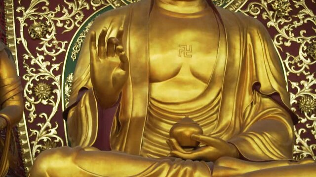 Statue of Buddha Siddhartha Gautama in a temple in Hangzhou China
