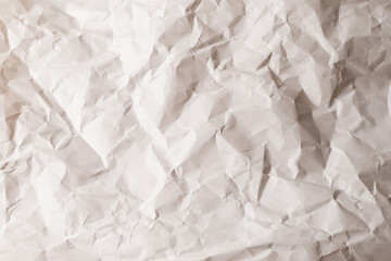 Crumpled white paper background.