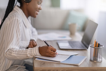 Closeup of black woman having online course, home interior