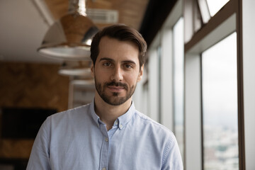 Head shot portrait confident businessman looking at camera, posing for profile picture, making...