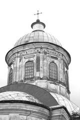 Domes of an Orthodox church against the sky. Black and white image. Orthodox baroque architecture. An old religious building.
