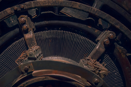 Closeup of copper electrical windings and contacts on a large vintage electrical motor generator set nobody