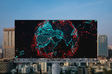 Glowing hologram of Earth planet map on billboard over aerial panoramic cityscape of Bangkok at sunset. The concept of international business in Southeast Asia.