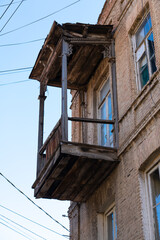 Fototapeta na wymiar Old wooden balcony view from the street