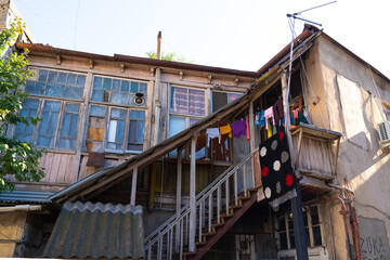 Old wooden closed balcony hanging linen