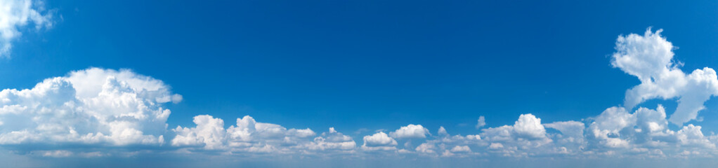 Panoramic fluffy cloud in the blue sky. Sky with cloud on a sunny day.