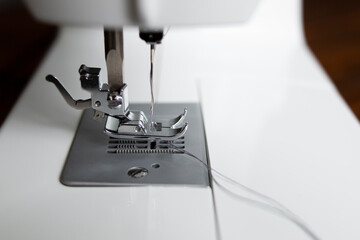 Sewing machine. Close-up of the hook and feet on the sewing machine